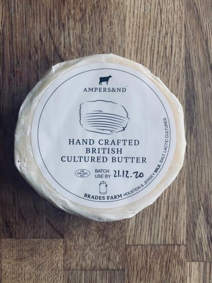 A picture of a single wheel of butter in its packaging
